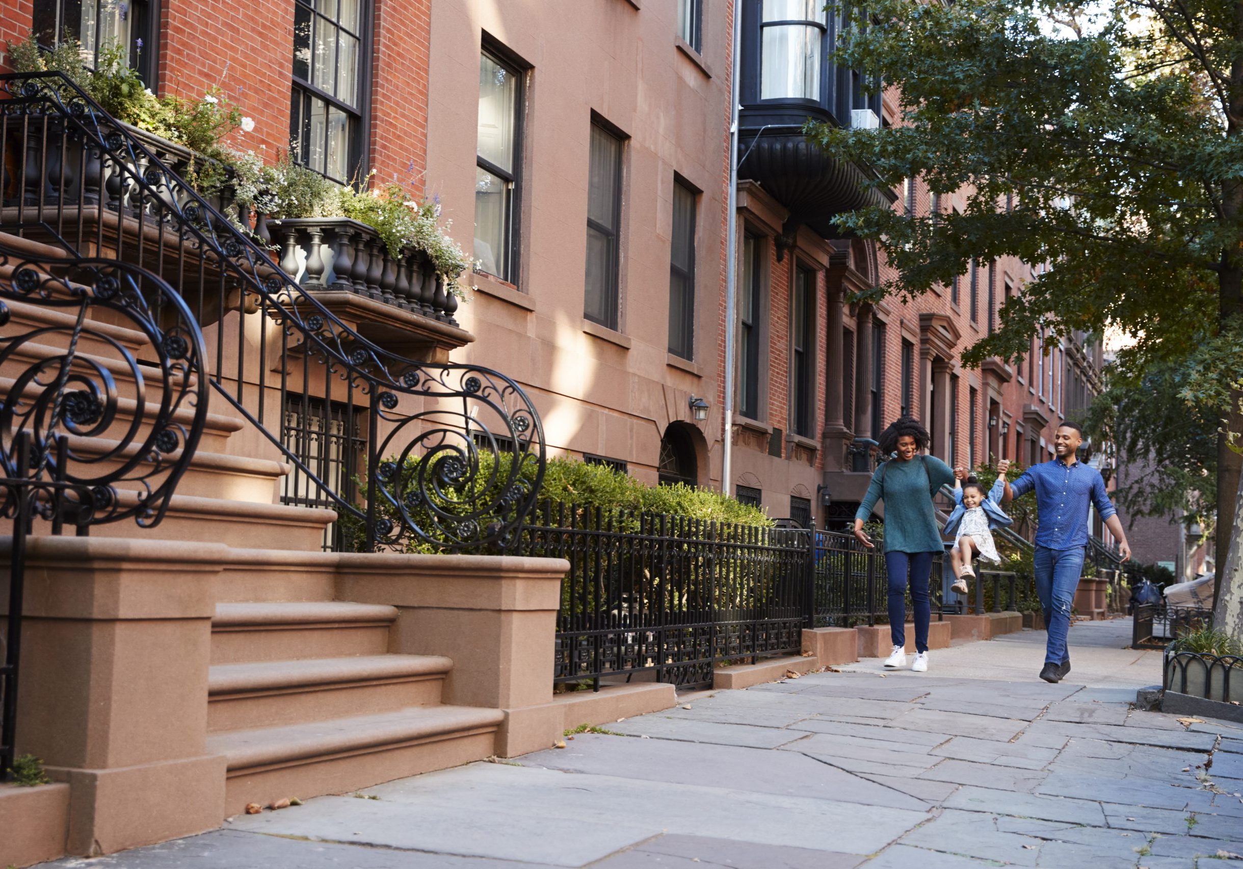 Family taking a walk down the street, close up